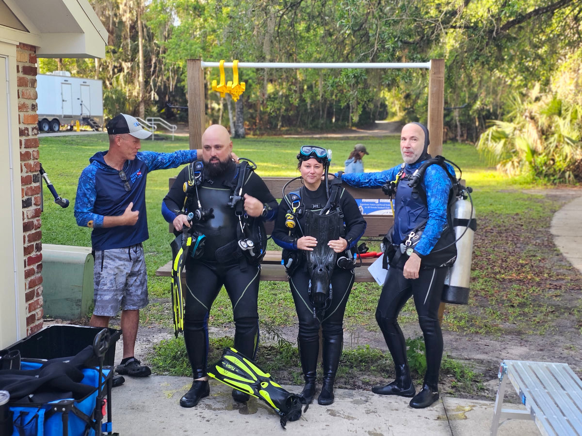 Florida Dive Company guides with two certified divers suited up for a private scuba tour at Blue Spring State Park